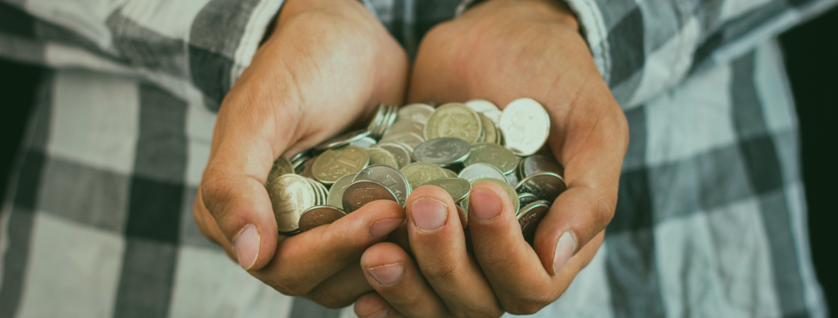 man-holding-hands-saving-coins
